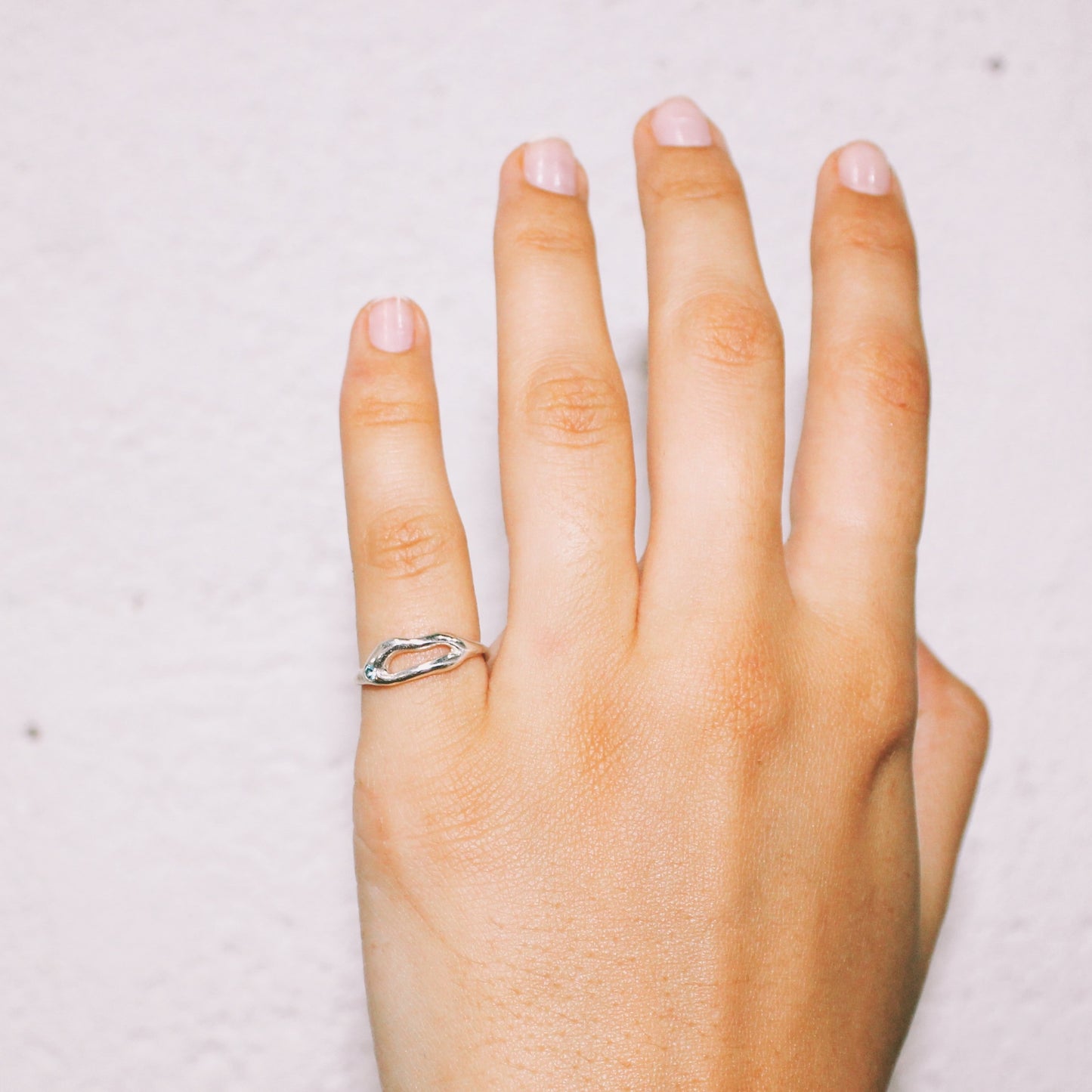 Hand wearing a silver ring handmade jewelry lisbon
