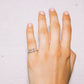 Hand wearing a silver ring handmade jewelry lisbon