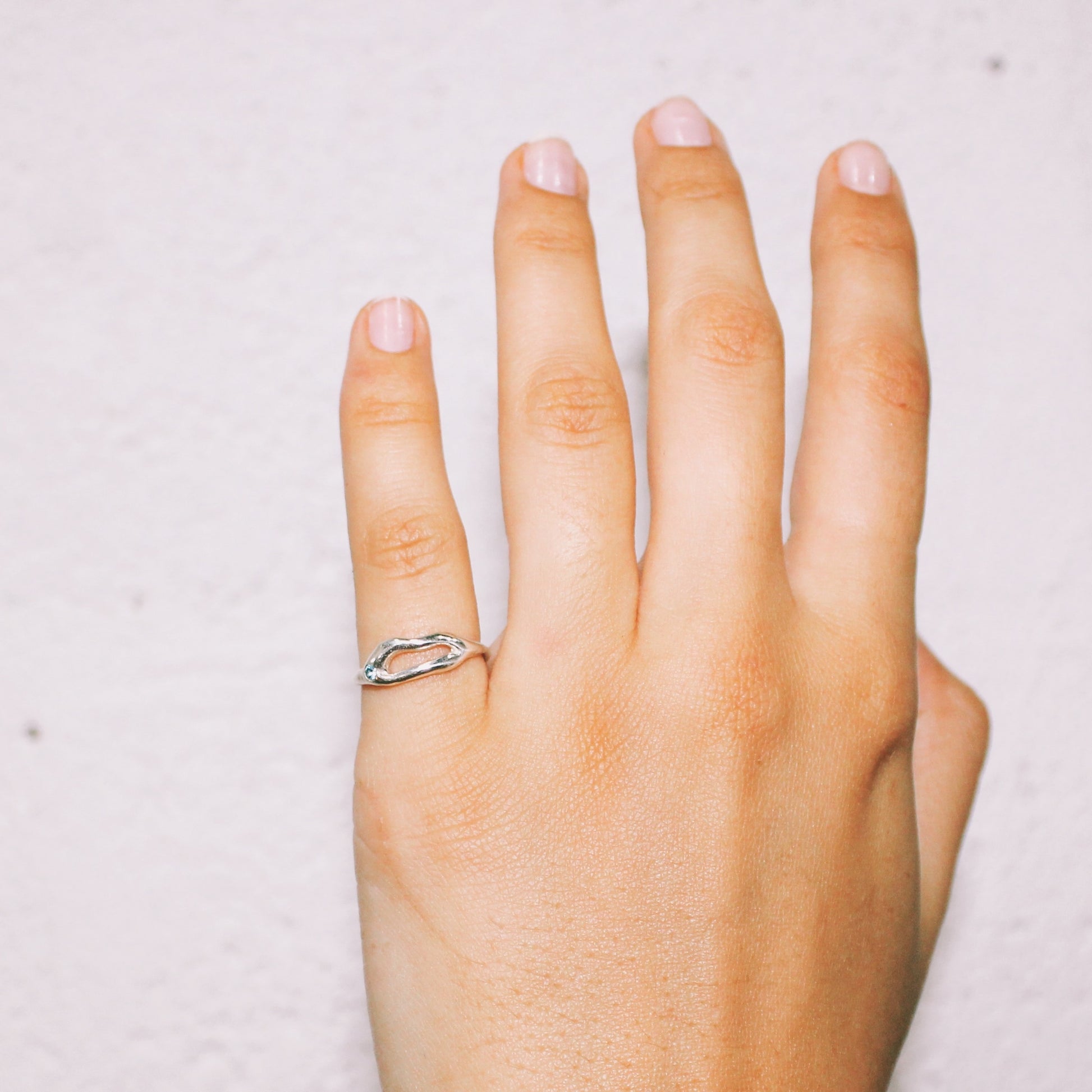 Hand wearing a silver ring handmade jewelry lisbon