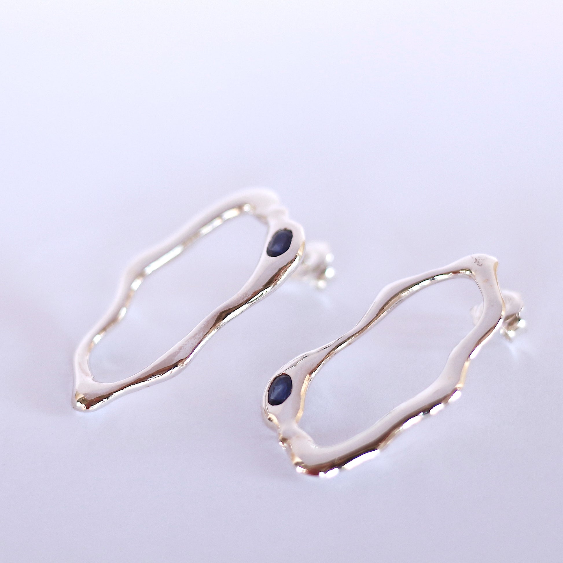 Silver Earrings with blue sapphire handmade jewelry design fluidity statement handcrafted fashion ocean drop